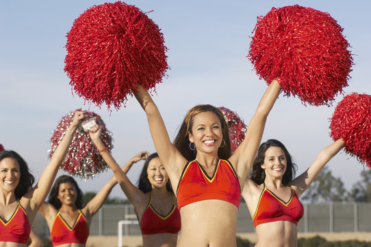 Group Of Happy Multiethnic Cheerleaders Cheering With Pompom