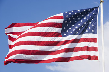 American flag with sky in the background