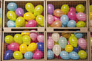 balloons in four cage boxes