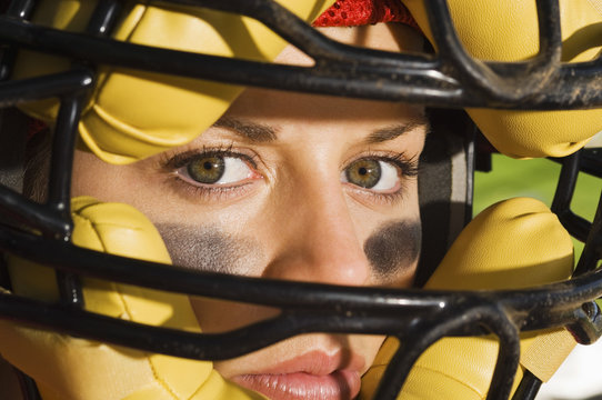 Closeup of confident female catcher wearing mask