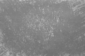 Fragment of  old grungy texture with chipped paint and cracks or concrete wall and cement surface