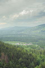 mountains under mist in the morning and city in the valley