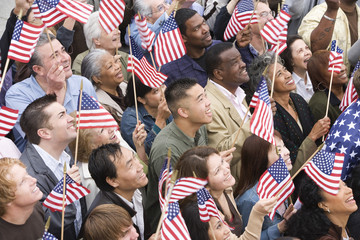 High angle view of happy multi ethnic people holding American flag - Powered by Adobe