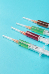 syringe on blue background.