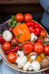 vegetables and mushrooms on the wooden plate