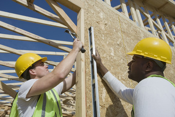 Manual workers working together at construction site