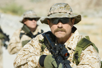 Confident soldiers with sniper rifles on a mission