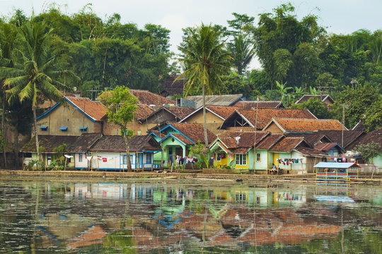 Traditional homes and Situ Cangkuang lake at this village known for its Hindu temple, Kampung Pulo, Garut, West Java, Indonesia