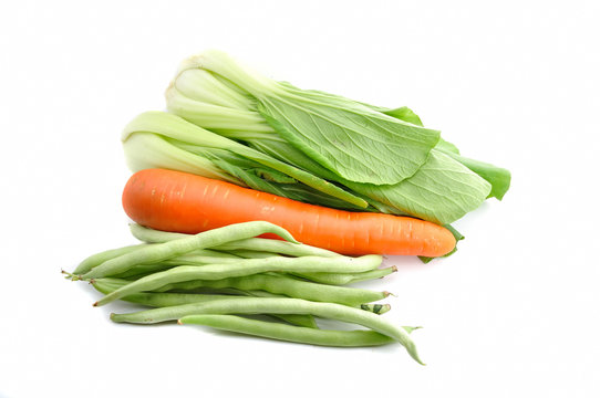 Beautiful Bok choy (chinese cabbage or Qing geng cai) isolated on white with carrots