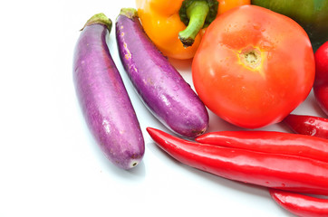 Fresh juicy peppers and tomatoes with eggplant  isolated on white background