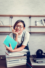 Picture of Asian women were happy to learn from reading
