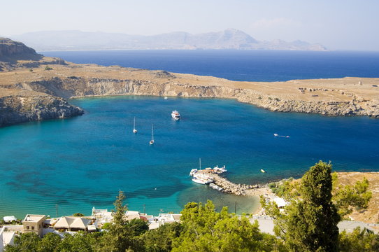 An aerial view of Lindos Bay, Lindos, Rhodes, Dodecanese Islands, Greek Islands, Greece