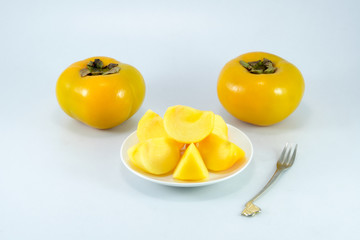 fresh ripe persimmons isolated on white background