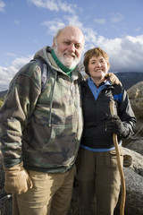Portrait of happy senior couple hiking together
