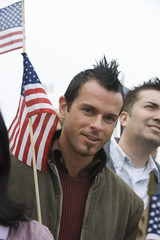 Close up of happy young man with American flag