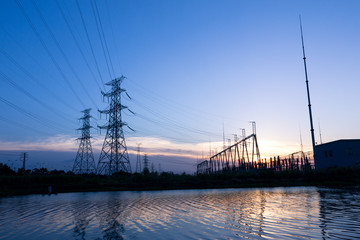 pylons near power station by river