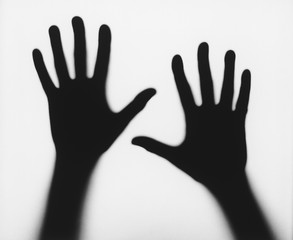 Silhouette of hands isolated over white background
