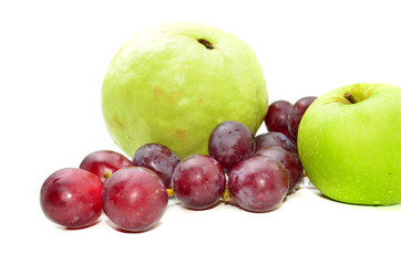 Fresh guava and green apple with red grapes isolated on white background