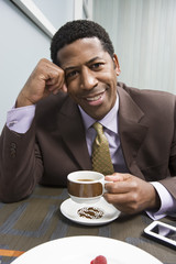 Portrait of an African American happy man drinking coffee