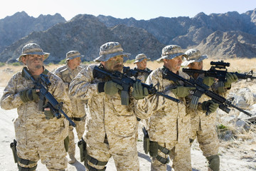 Troop of army soldiers with rifles on a mission
