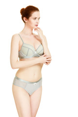 Fototapeta premium Attractive slim woman in grey matching underwear