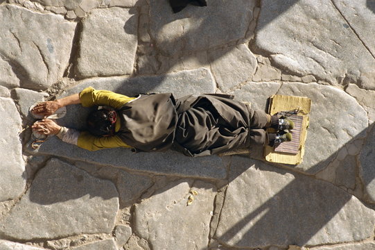 Pilgrim prostrating, Jokhang Temple, Barkhor, Lhasa, Tibet, China
