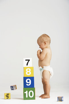 Side View Of Baby Building Blocks With Numbers Isolated On White Background