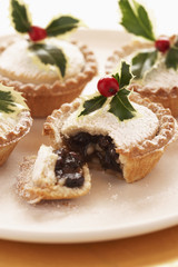 Decorated mince pies on plate close-up