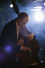 Man playing the double bass on stage