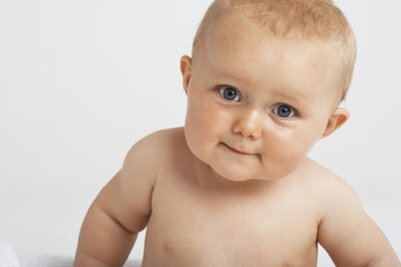 Closeup portrait of cute baby isolated on white background