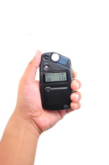 Hand holding a light meter