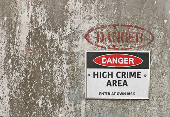 red, black and white Danger, High Crime Area warning sign