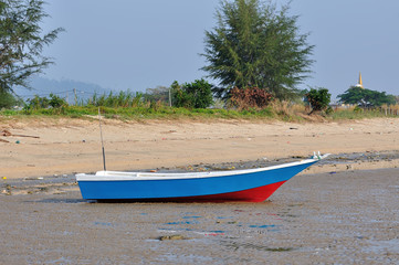 Fishing boat on the beach in the morning