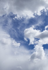 Cumulus clouds against the blue sky background