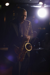 Musician playing saxophone in the jazz club