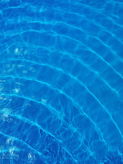 Rippled blue water in swimming pool view from above