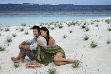 Couple on deserted island, Maldives