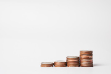 Coins stacked on white background. show on growth and saving idea for financial concept.