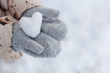heart of snow on the grey mittens.
