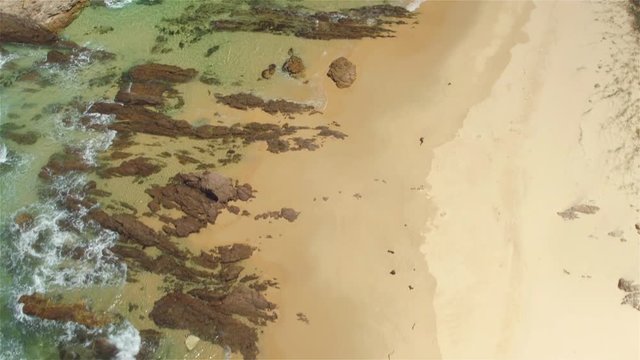 AERIAL: Flying over magnificent diversified ocean coast on sunny summer day