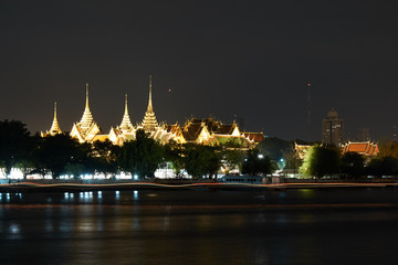 Wat Phra Kaew and Grand Palace from Chao Phraya river night view.  Bangkok Thailand.