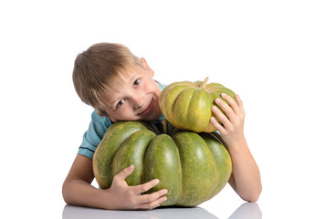 Fototapeta premium Cute boy with different pumpkins on halloween