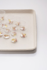 Obraz na płótnie Canvas Pills in plastic cups on tray