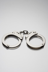 Handcuffs isolated on colored background