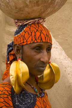 Portrait of a Fulani woman wearing traditional gold earrings, Mopti, Mali, West Africa