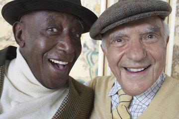 Closeup portrait of cheerful multiethnic senior men smiling