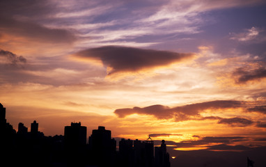 Sunset sky background with city background