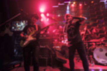 Blur image of a crowd of people at a concert live show on stage,Background concept