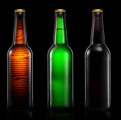Set of beer bottles isolated on black background.