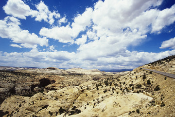 Cloudscape above rocky landscape